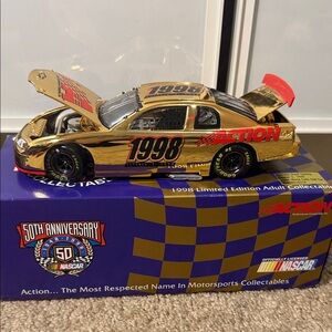 Nascar Gold Monte Carlo 1998 Collectible Die-Cast Car. Charlotte grand opening